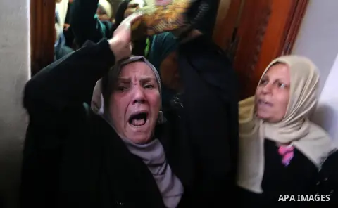 Relatves of Palestinian Youssef el-Daya, 15, who was shot dead by Israeli forces during clashes with Israeli troops in tents protest where Palestinians demand the right to return to their homeland at the Israel-Gaza bord...
