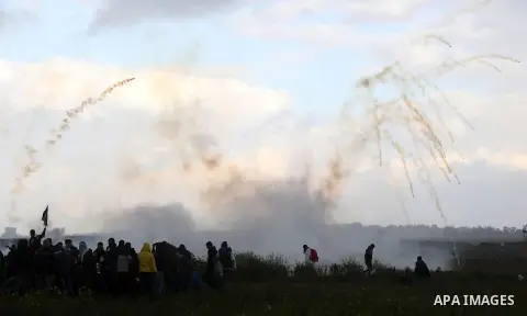 Palestinian protesters clash with Israeli troops following the tents protest where Palestinians demand the right to return to their homeland at the Israel-Gaza border, in Khan Younis in the southern Gaza Strip, March 01,...