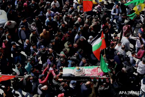 Mourners carry the body of Palestinian Samah Mubarak, 16, during her funeral in the West Bank city of Ramallah, on March 9, 2019, after the Israeli army handed over the corpse of the girl. Israeli officers shot dead Muba...