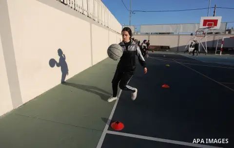 Palestinian girls attend a training session in the basketball stars academy, in Gaza city on March 10, 2019. The Academy is a team of trainers and teachers specialized in the training of boys and girls basketball, as wel...