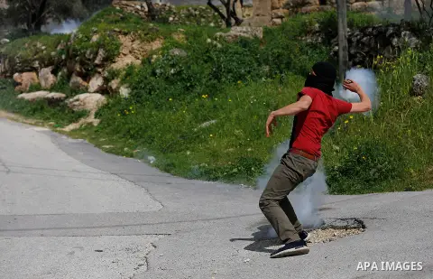 Palestinian protesters clash with Israeli security forces following a protest demand return bodies of killed Palestinians that are being held by Israel, in the Beit Sira village, near the West Bank city of Ramallah, Marc...
