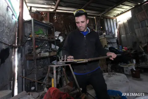 Anas Helles, a 27 year-old Palestinian blacksmith, make creative metal sculptures at his workshop in Gaza city, on March 17, 2019. Helles try to work on his free time to turn recycled metals into scrap metal art beside h...