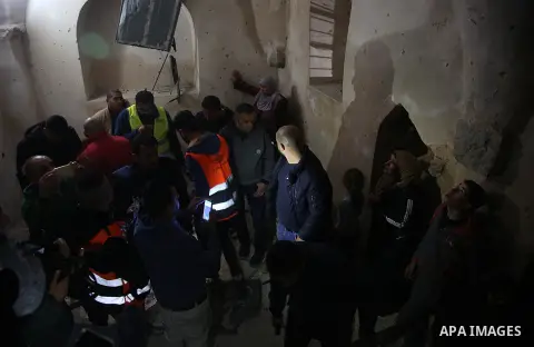 Palestinians check a damaged house where a Palestinian Omar Abu Laila was killed by Israeli forces, in Abwein village, in the West Bank, on March 20, 2019. Photo by Hamza Shalash / WAFA / APAimages