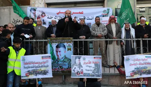 Hamas supporters take part in a protest against the killing of Palestinian Omar Abu Leila by Israeli security forces in the village of Ebwin, in Jabalia in the northern Gaza Strip, March 20, 2019. Omar Abu Leila, 19, was...