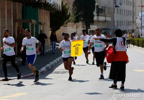 Palestinian and foreign activsts take part in the Palestine Marathon, in the West Bank city of Bethlehem, Friday, March 22, 2019. Palestine seventh international marathon kicked off this morning in Bethlehem with the par...