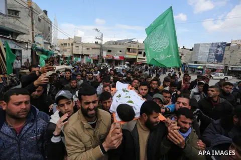 Mourners carry the body of Palestinian Bilal al-Najjar, 17, who was shot dead by Israeli forces at the Israel-Gaza border, during his funeral in Khan Younis in the southern of Gaza strip, on March 31, 2019. Photo by Ashr...