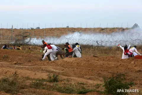 A wounded Palestinian protester is evacuated during clashes with Israeli troops following the tents protest where Palestinians demand the right to return to their homeland at the Israel-Gaza border, in Khan Younis in the...