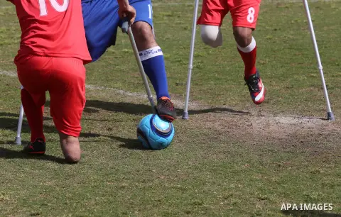 Palestinian amputees using crutches play a football match during the first football tournament for amputees, at Palestine Stadium in Gaza city, on April 13, 2019. More than 125 have had amputations shot by Israeli forces...