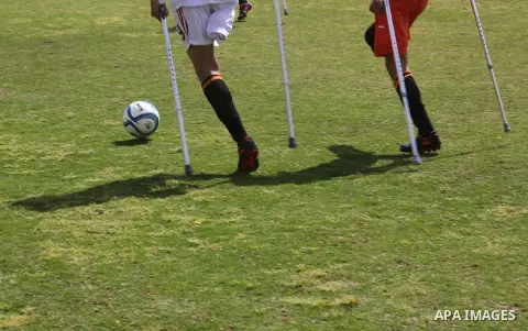 Palestinian amputees using crutches play a football match during the first football tournament for amputees, at Palestine Stadium in Gaza city, on April 13, 2019. More than 125 have had amputations shot by Israeli forces...