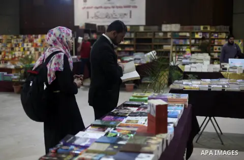 Palestinians attend the opening ceremony of An exhibition "Gaza Hashem Book", in Gaza city on April 14, 2019. Photo by Mahmoud Ajjour