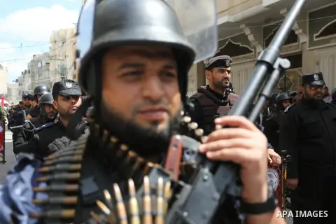 Palestinian members of the security services take part during a military parade, in Khan Younis in the southern Gaza strip on April 16, 2019. Photo by Ashraf Amra