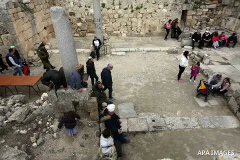Israeli Jewish settlers visitors are seen at an ancient Roman historical site as they celebrating the Jewish holiday of Passover, in the village of Sebastia, near the West Bank city of Nablus, April 22, 2019. Photo by Sh...