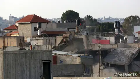 An Israeli machinery demolishes the family house of Palestinian assailant Omar Abu Laila was killed by Israeli forces in Az-Zawiya village, in the West Bank, April 24, 2019. Abu Leila, was suspected of carrying out a dea...