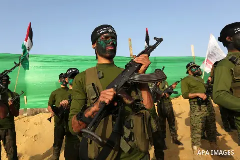 Palestinian militants of al-Mujahideen Brigades, show their military skills during a graduation ceremony, in Gaza city on April 24, 2019. Photo by Ashraf Amra