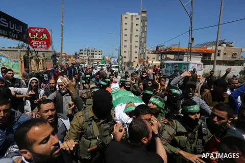 Mourners carry the body of Palestinian Alaa Al-Bubli, who was shot dead by Israeli forces at the Israel-Gaza border, during his funeral in al-Maghazi in the center of the Gaza Strip on May 4, 2019. Photo by Ashraf Amra