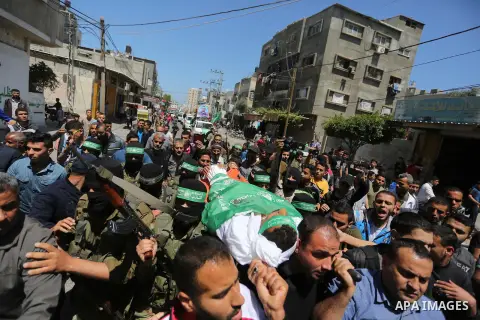 Mourners carry the body of Palestinian Alaa Al-Bubli, who was shot dead by Israeli forces at the Israel-Gaza border, during his funeral in al-Maghazi in the center of the Gaza Strip on May 4, 2019. Photo by Ashraf Amra