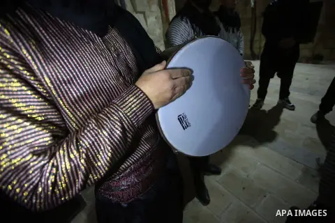 Palestinians "dawn awakeners" or Al Musaharati in Arabic, wake Muslims for their overnight 'sahur', last meal, before the day's fast, as they walk through streets in the old city of the West Bank city of Nablus just befo...