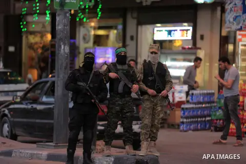 Palestinian militants of Ezzeddin al-Qassam brigades, loyal to Hamas movement, and Al-Quds brigades, loyal to Islamic Jihad movement, patrol in a street, in Gaza city on May 12, 2019. Palestinian officials said Israel ha...