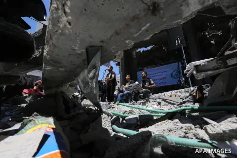 Members of the Palestinian band Dawaween perform during a musical event calling for a boycott of the Eurovision Song Contest hosted by Israel, on the rubble of a building that was recently destroyed by Israeli air strike...