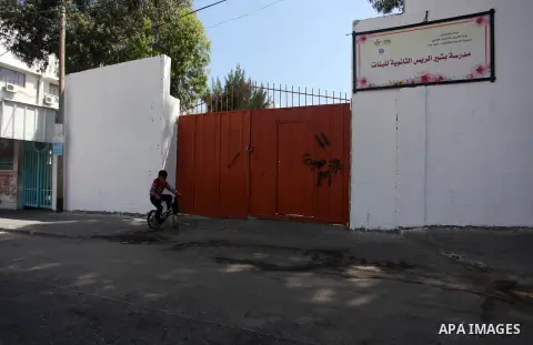 Palestinians walk past closed shops during a general strike marking the 71st anniversary of the "Nakba in Gaza city on May 15, 2019. The "Nakba," or catastrophe, commemorates the mass displacement of more than 700,000 Pa...