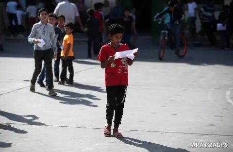 Palestinian students receive their the school certificates in Gaza City, on May 29, 2019. Photo by Mahmoud Ajjour