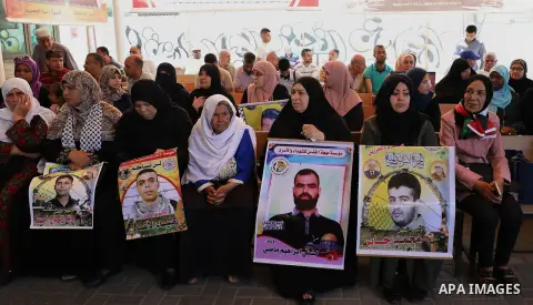 Palestinians take part in a protest to show solidarity with Palestinian Prisoners held in Israeli jails, in front of Red Cross office, in Gaza city, on June 3, 2019. Photo by Mahmoud Naser