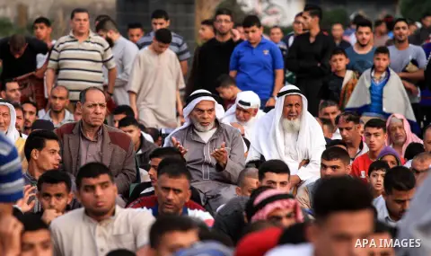 Palestinian Muslim worshipers perform the morning prayer of Eid al-Fitr holiday which marks the end of the Muslim holy month of Ramadan, in Dair Al Balah in the center of Gaza strip on June 5, 2019. Photo by Mahmoud Khat...