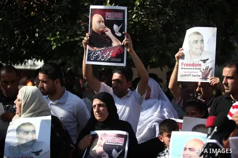 Protesters hold photos of Mohammed al-Halabi, a Palestinian prisoner in the Israeli jails, during a demonstration demanding for his freedom, in Gaza city on June 15, 2019. Palestinian charity worker Mohammed Halabi was s...