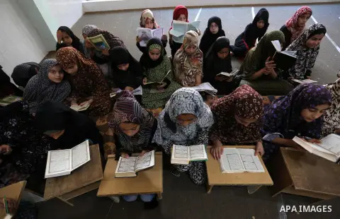 Palestinian girls attend a Quran lesson, during summer vacation at a Mosque, in Khan Younis in the southern of Gaza strip, on June 18, 2019. Photo by Ashraf Amra