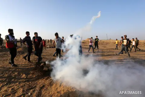 Palestinian protesters clash with Israeli troops following the tents protest where Palestinians demand the right to return to their homeland at the Israel-Gaza border, in Khan Younis in the southern Gaza Strip, June 21,...
