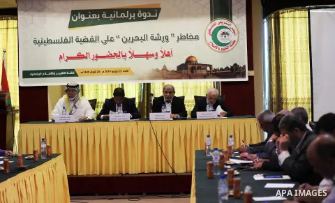 Palestinian Legislative Council members of the mass of change and reform attend a meeting against the Bahrain economic workshop, in Gaza city on June 23, 2019. Photo by Mahmoud Naser