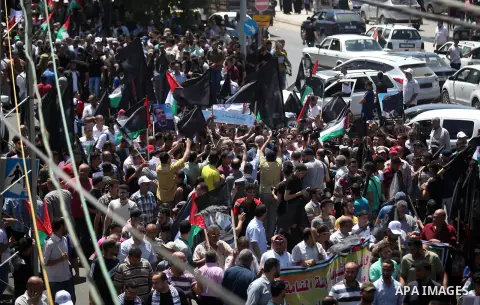 Palestinian protesters shot slogans during a protest against the Bahrain economic workshop, in Gaza city, on June 26, 2019. Kicking off the Trump administration’s international peace conference in Bahrain Tuesday, US Pre...
