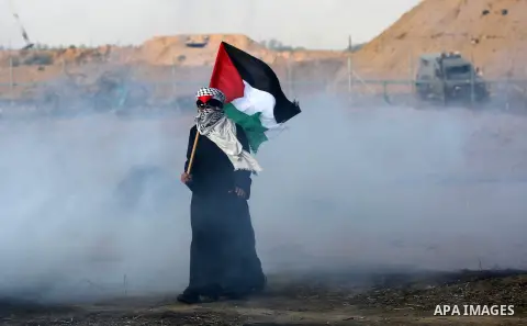 Palestinian protesters clash with Israeli troops following the tents protest where Palestinians demand the right to return to their homeland at the Israel-Gaza border, in Khan Younis in the southern Gaza Strip, June 28,...