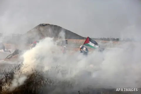 Palestinian protesters clash with Israeli troops following the tents protest where Palestinians demand the right to return to their homeland at the Israel-Gaza border, in Khan Younis in the southern Gaza Strip, June 28,...