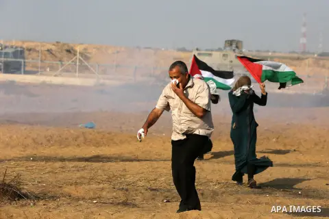 Palestinian protesters clash with Israeli troops following the tents protest where Palestinians demand the right to return to their homeland at the Israel-Gaza border, in Khan Younis in the southern Gaza Strip, June 28,...