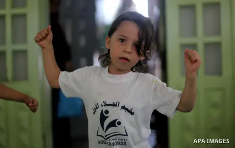 Palestinian children participate in a Zumba class during the summer vacation, at Jalaa Gym, in Gaza city, on June 30, 2019. Zumba is an exercise fitness program created by Colombian dancer and choreographer Alberto "Beto...