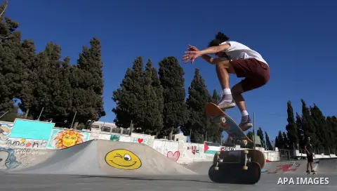A foreign activist skateboards in a skatepark in the village of Asira ash-Shamaliya, near the West Bank city of Nablus, July 02, 2019. Skateboarding is an action sport which involves riding and performing tricks using a...