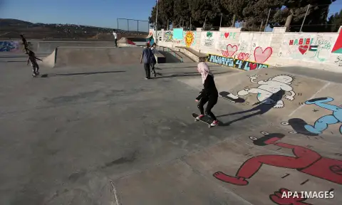 Palestinians and foreign activists skateboard in a skatepark in the village of Asira ash-Shamaliya, near the West Bank city of Nablus, July 02, 2019. Skateboarding is an action sport which involves riding and performing...