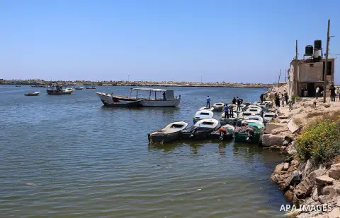 Palestinian fishermen ride their fishing boats after it was delivered by Israeli forces, in the east of Gaza city, July 03, 2019. Israel and Hamas reportedly renewed a truce agreement last week and agreed to send diesel...