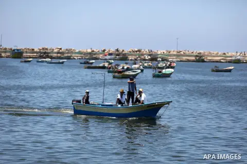 Palestinian fishermen ride their fishing boat after it was delivered by Israeli forces, in the east of Gaza city, July 03, 2019. Israel and Hamas reportedly renewed a truce agreement last week and agreed to send diesel f...