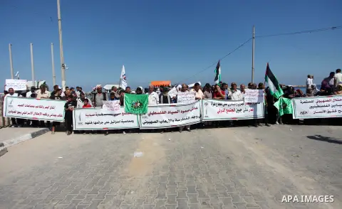 Palestinian fishermen take part in a protest against Israeli attacks for fishermen at Gaza seaport on July 04, 2019. Photo by Mahmoud Ajjour