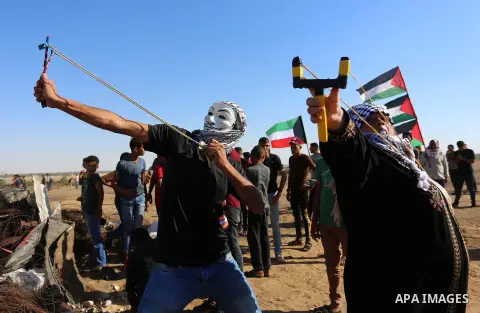 Palestinian protesters clash with Israeli troops following the tents protest where Palestinians demand the right to return to their homeland at the Israel-Gaza border, in Khan Younis in the southern Gaza Strip, July 05,...