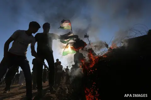 Palestinian protesters clash with Israeli troops following the tents protest where Palestinians demand the right to return to their homeland at the Israel-Gaza border, in Khan Younis in the southern Gaza Strip, July 05,...