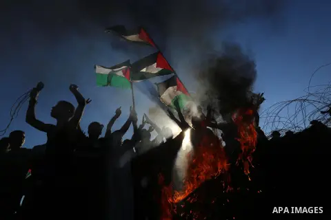Palestinian protesters clash with Israeli troops following the tents protest where Palestinians demand the right to return to their homeland at the Israel-Gaza border, in Khan Younis in the southern Gaza Strip, July 05,...
