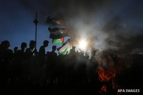 Palestinian protesters clash with Israeli troops following the tents protest where Palestinians demand the right to return to their homeland at the Israel-Gaza border, in Khan Younis in the southern Gaza Strip, July 05,...
