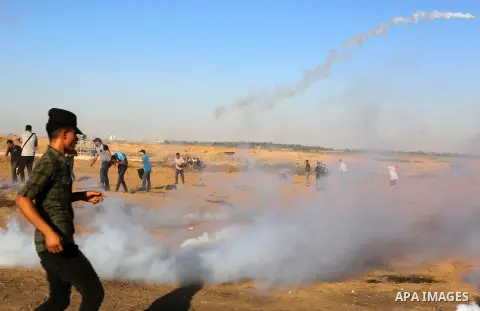 Palestinian protesters clash with Israeli troops following the tents protest where Palestinians demand the right to return to their homeland at the Israel-Gaza border, in Khan Younis in the southern Gaza Strip, July 05,...