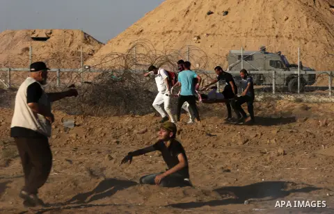 Palestinian protesters clash with Israeli troops following the tents protest where Palestinians demand the right to return to their homeland at the Israel-Gaza border, in Khan Younis in the southern Gaza Strip, July 05,...