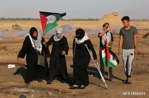 Palestinian protesters clash with Israeli troops following the tents protest where Palestinians demand the right to return to their homeland at the Israel-Gaza border, in Khan Younis in the southern Gaza Strip, July 05,...