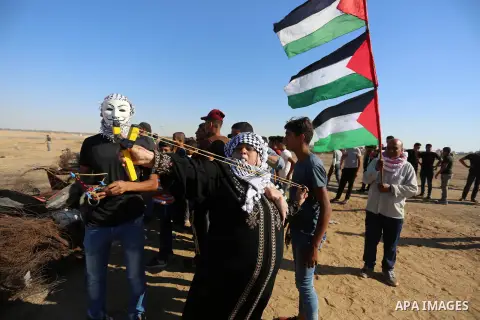 Palestinian protesters clash with Israeli troops following the tents protest where Palestinians demand the right to return to their homeland at the Israel-Gaza border, in Khan Younis in the southern Gaza Strip, July 05,...