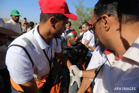 A wounded Palestinian protester is evacuated during clashes with Israeli troops following the tents protest where Palestinians demand the right to return to their homeland at the Israel-Gaza border, in Khan Younis in the...